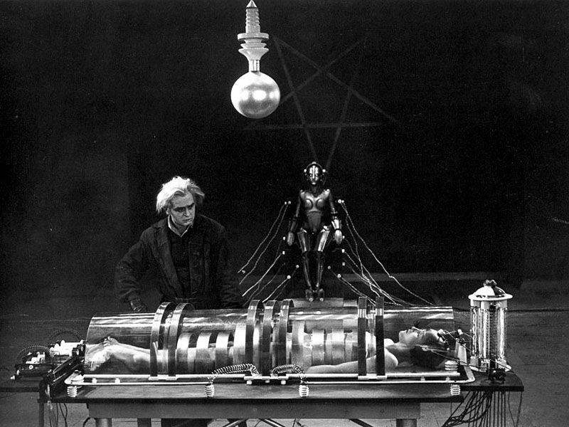 Mad scientist Rotwang (Rudolf Klein-Rogge) prepares to transform his robot into the likeness of Maria (Brigitte Helm)