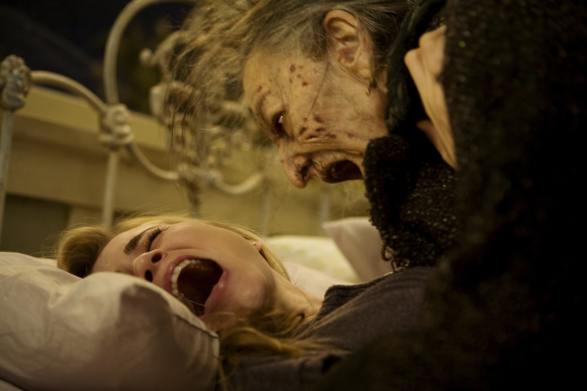 Christine (ALISON LOHMAN) is attacked by Mrs. Ganush (LORNA RAVER) 