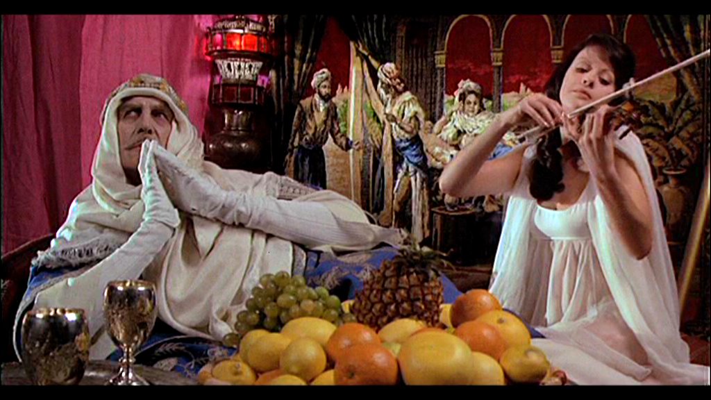 Phibes (Vincent Price) with the new Vulnavia (Valli Kemp)