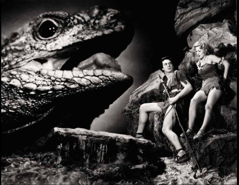Victor Mature and Carol Landis confront a magnified lizard meant to be a dinosaur.