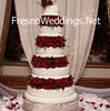 5 tiered wedding cake with red roses